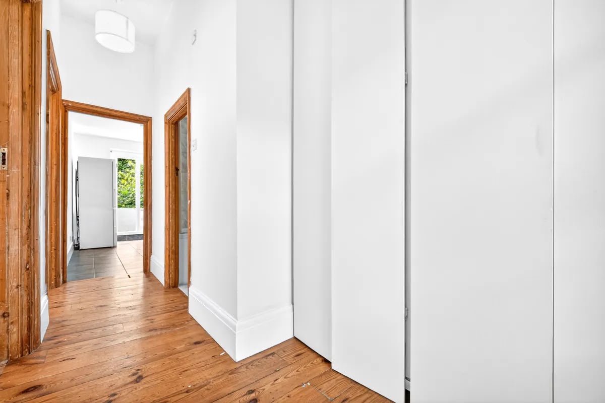 Hallway with pine doors and restored floorboards