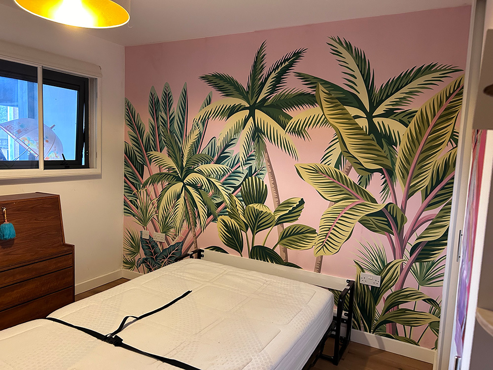 Palm-print mural wallpaper in a bedroom